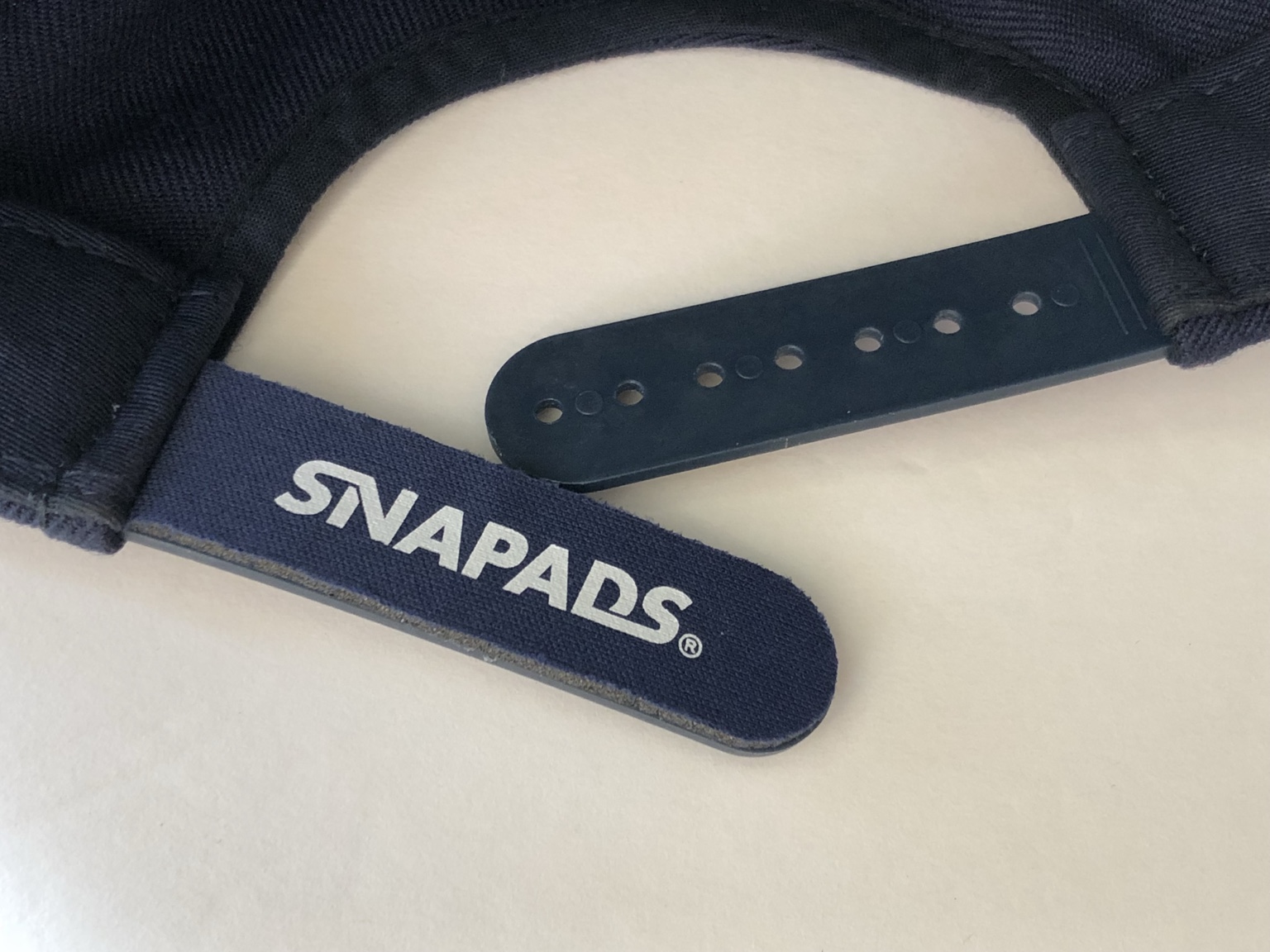 Red SnaPads installed on a red snapback